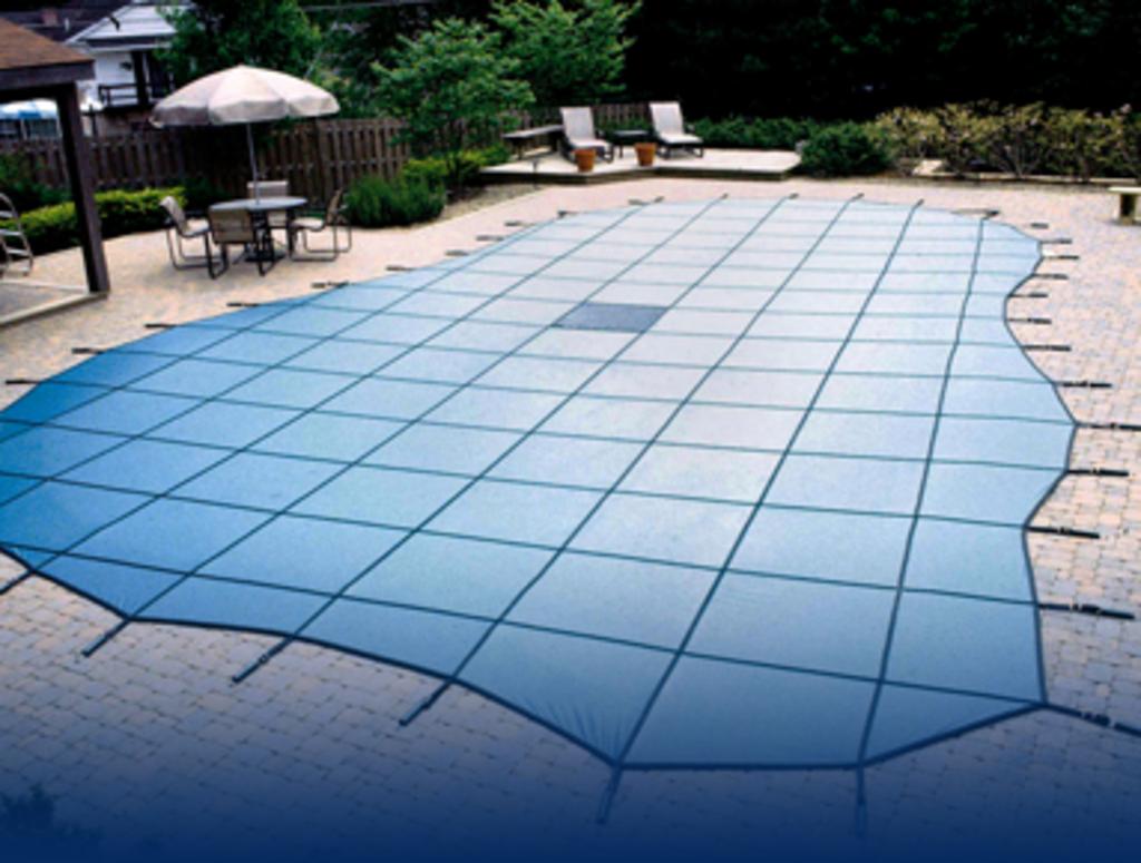 custom cover attached to an inground pool