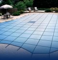 custom cover attached to an inground pool